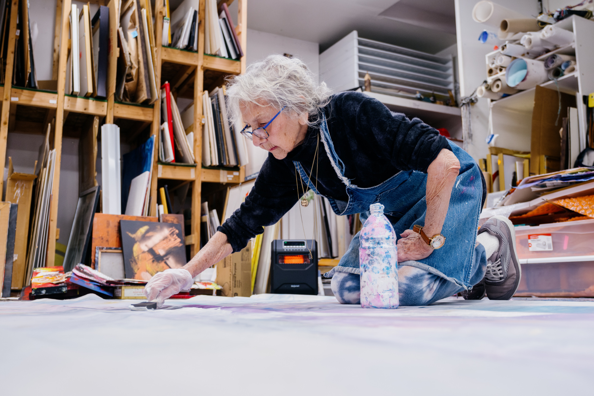 Photo of 2024 Kresge Eminent Artist Nora Chapa Mendoza working in her home studio